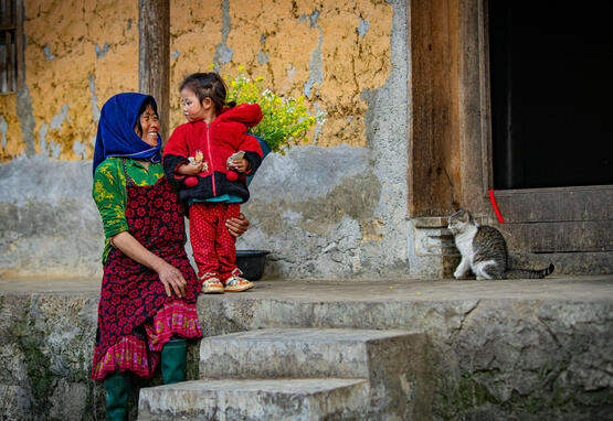 Mother, daughter, and cat in Vietnam